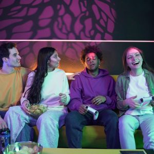 medium-shot-happy-friends-playing-videogames_23-2149350030